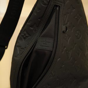 Alternative view of Men's Chest Bag Series DUO Shoulder Bag This Duo shoulder bag features a soft calf leather construction for a form-fitting silhouette, offering a practical alternative to traditional backpacks. The zippered side pocket accommodates smartphones, while the detachable organizer pouch facilitates easy access to essentials. The adjustable jacquard fabric shoulder strap allows for crossbody or shoulder carry. Dimensions: 20 x 42 x 6 cm.